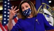 (FILES) In this file photo taken on October 09, 2020 US Speaker of the House, Nancy Pelosi, Democrat of California, speaks to the press on Capitol Hill in Washington, DC. House Speaker Nancy Pelosi made progress in US stimulus negotiations with Treasury S