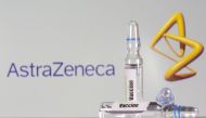 FILE PHOTO: A test tube labeled with the vaccine is seen in front of AstraZeneca logo in this illustration taken, September 9, 2020. REUTERS/Dado Ruvic/File Photo