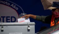 Vehicles drive through to drop off their mail-in ballots at the Registrar of Voters for San Diego County in San Diego, California, U.S., October 19, 2020. REUTERS/Mike Blake
