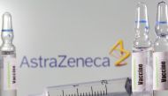 A test tube labelled vaccine is seen in front of AstraZeneca logo in this illustration taken, September 9, 2020. REUTERS/Dado Ruvic/Illustration/File Photo/File Photo