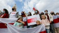 Demonstrators attend a rally in solidarity with Belarusian opposition supporters, who hold protests to reject the presidential election results and to demand the release of political prisoners in Belarus, in central Kyiv, Ukraine October 24, 2020. REUTERS