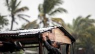 A man protects his beach house as Hurricane Eta approaches in Bilwi, Puerto Cabezas, Nicaragua, on November 2, 2020. Eta rapidly intensified to a Category 4 hurricane on Monday as it bore down on the Caribbean coast of Nicaragua and Honduras, threatening 