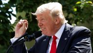 FILE PHOTO: U.S. President Donald Trump refers to amounts of temperature change as he announces his decision that the United States will withdraw from the landmark Paris Climate Agreement, in the Rose Garden of the White House in Washington, U.S., June 1,