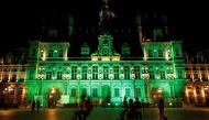 FILE PHOTO: Green lights are projected onto the facade of the Hotel de Ville in Paris, France, after U.S. President Donald Trump announced his decision that the United States will withdraw from the Paris Climate Agreement at a news conference June 1, 2017