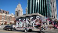 A supporter of U.S. President Donald Trump talks through a loudspeaker while driving his Trump Unity Bridge outside the TCF Center where poll workers are tabulating ballots after Election Day in Detroit, Michigan U.S., November 4, 2020. REUTERS/Rebecca Co
