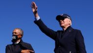 Democratic U.S. presidential nominee and former Vice President Joe Biden and former U.S. President Barack Obama gesture at a campaign drive-in, mobilization event in Flint, Michigan, U.S., October 31, 2020. REUTERS/Brian Snyder
