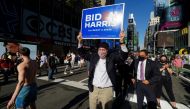 Senate Minority Leader Chuck Schumer (D-NY) carries a campaign placard after media announced that Democratic US presidential nominee Joe Biden has won the 2020 US presidential election, on Times Square in New York City, US, November 7, 2020. Reuters/Carlo