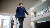 German Chancellor Angela Merkel wears a protective mask as she arrives to give a statement on the outcome of the 2020 U.S. presidential election in Berlin, Germany, November 9, 2020. Michael Kappeler/Pool via REUTERS