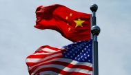 FILE PHOTO: Chinese and U.S. flags flutter near The Bund, before U.S. trade delegation meet their Chinese counterparts for talks in Shanghai, China July 30, 2019. REUTERS/Aly Song/File Photo
