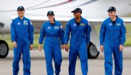 NASA astronauts Shannon Walker, Victor Glover, Mike Hopkins, and JAXA (Japan Aerospace Exploration Agency) astronaut Soichi Noguchi, who comprise Crew-1, walk at Kennedy Space Center ahead of the NASA/SpaceX launch of the first operational commercial crew
