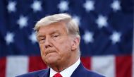 US President Donald Trump looks on after delivering an update on 