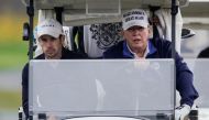 U.S. President Donald Trump drives a golf cart at the Trump National Golf Club in Sterling, Virginia, U.S., November 15, 2020. REUTERS/Joshua Roberts