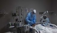 A medical staff member treats a patient suffering from coronavirus in the COVID-19 intensive care unit (ICU) at United Memorial Medical Center on November 16, 2020 in Houston, Texas. Texas has recorded more than 1.1 million cases of the disease, with more