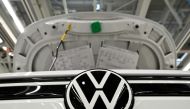 A car stands at the production line for the electric Volkswagen cars, model ID.3 and model ID. 4, in Zwickau, Germany, September 18, 2020. Picture taken September 18. REUTERS/Matthias Rietschel/File Photo