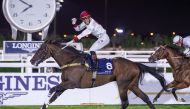 Alberto Sanna riding Perfect Empire celebrates the win at QREC's Al Rayyan Park yesterday. 