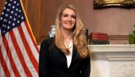 In this file photo taken on September 30, 2020 Republican Senator from Georgia Kelly Loeffler smiles as she meets with US Supreme Court nominee Amy Coney Barrett (off frame) at the US Capitol in Washington, DC. A US Republican senator contesting a closely