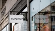 FILE PHOTO: Signage can be seen outside a Topshop and Topman store, owned by Arcadia Group, in central London, Britain June 5, 2019. REUTERS/Henry Nicholls