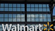 In this file photo taken on August 18, 2020 a Walmart logo is seen outside a store in Washington, DC. Walmart reported another strong quarter on November 17, 2020, pivoting during the coronavirus pandemic, with more consumers shifting to e-commerce and sh