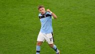 Lazio's Italian forward Ciro Immobile celebrates scoring a penalty during the UEFA Champions League group F football match BVB Borussia Dortmund v Lazio in Dortmund, western Germany, on December 2, 2020. / AFP / POOL / Bernd Thissen