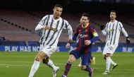 FC Barcelona's Lionel Messi in action with Juventus' Cristiano Ronaldo. Reuters/Albert Gea