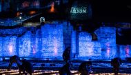 People install a light fresco of 20 000 light bulbs entitled 