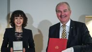 French scientist Emmanuelle Charpentier, director of the Max Planck Institute for Infection Biology in Berlin, 2020 Nobel Prize winner in Chemistry for the development of a method for genome editing, poses after receiving her Nobel diploma and medal from 
