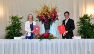 Britain’s trade minister Liz Truss and Singapore's trade minister Chan Chun Sing sign a free trade agreement in Singapore December 10, 2020. 