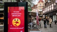 An information sign wishing Merry Christmas and asking to maintain social distancing is seen at a pedestrian shopping street amid the spread of the coronavirus disease (COVID-19) in Helsingborg, Sweden, December 7, 2020. Johan Nilsson/TT News Agency/via R