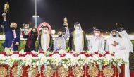 Minister of Culture and Sports, H E Salah bin Ghanem Al Ali, and Chairman of the Qatar and Asian Equestrian Federations, Hamad bin Abdulrahman Al Attiyah, posing for a photograph with Team Al Namaa after Al Shaqab Racing's homebred horse won the Late Shei
