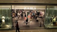 A staff wearing protective mask waits for customers at the entrance of a Zara store, amid the coronavirus disease (COVID-19) outbreak in Kuala Lumpur, Malaysia May 27, 2020. REUTERS/Lim Huey Teng/File Photo