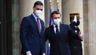 In this file photo taken on December 14, 2020 French President Emmanuel Macron (R) welcomes Spanish Prime minister Pedro Sanchez prior to a meeting marking the 60th anniversary of the creation of the Organisation for Economic Co-operation and Development 