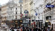 People walk down a shopping street amid the government reopening bigger shops as well as small businesses in a loosening of the second lockdown due to the coronavirus disease (COVID-19) outbreak, in Vienna, Austria December 7, 2020. REUTERS/Leonhard Foege