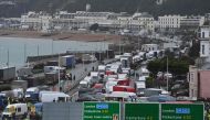 Traffic queues trying to enter the port of Dover in Kent, south east England, on December 23, 2020, that is still cordoned after the UK and France agreed a protocol to reopen the border to accompanied freight arriving in France from the UK requiring all l