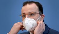 German Health Minister Jens Spahn wears a face mask as he arrives for a press conference in Berlin, Germany, on December 30, 2020, to comment on the current situation amid the new coronavirus, COVID-19 pandemic and the vaccination campaign in Germany. / A