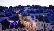 A general view shows an empty street with trulli, limestone buildings of Alberobello, a World Heritage Site, lit up with Christmas lights, as Italy goes back to a complete lockdown during Christmas season as part of efforts to curb the spread of the coron