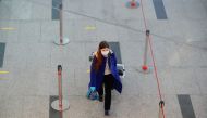 A woman wearing a protective mask walks at the departure zone of Vnukovo International Airport in Moscow, Russia December 30, 2020. REUTERS/Evgenia Novozhenina