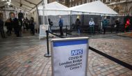 People queue at London Bridge Vaccination Centre, amid the coronavirus disease (COVID-19) outbreak, in London, Britain, January 5, 2021. REUTERS/Henry Nicholls