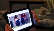Teacher Wendy Couldridge watches on a device as Britain's Prime Minister Boris Johnson announces a lockdown in England, amid the coronavirus disease (COVID-19) outbreak, in Hertford, Britain, January 4, 2021. Reuters/Andrew Couldridge