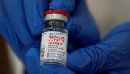 FILE PHOTO: An employee shows the Moderna coronavirus disease (COVID-19) vaccine at Northwell Health's Long Island Jewish Valley Stream hospital in New York, U.S., December 21, 2020. REUTERS/Eduardo Munoz