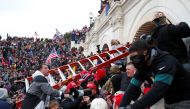 Pro-Trump protesters storm into the US Capitol during clashes with police, during a rally to contest the certification of the 2020 US presidential election results by the US Congress, in Washington, US, January 6, 2021. Reuters/Shannon Stapleton