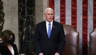 US Vice President Mike Pence reads the final certification of Electoral College votes cast in November's presidential election during a joint session of Congress after working through the night, at the Capitol in Washington, US, January 7, 2021. J Scott A