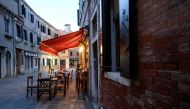 A restaurant frustrated with being shut by the government due to coronavirus disease (COVID-19) restrictions defies the rules and opens to the public as part of a nationwide protest against the ongoing curbs, in Venice, Italy, January 15, 2021. REUTERS/Ma