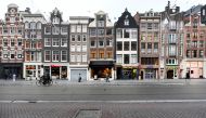 FILE PHOTO: People walk on an empty street as Netherlands has gone into lockdown as the spread of the coronavirus disease (COVID-19) continues in Amsterdam, Netherlands December 15 2020, REUTERS/Piroschka van de Wouw/File Photo
