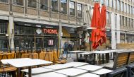 FILE PHOTO: Tables and chairs are stacked on an empty shopping street as Netherlands is set to extend the lockdown as the spread of the coronavirus disease (COVID-19) continues in Rotterdam, Netherlands January 12, 2021. REUTERS/Piroschka van de Wouw/File