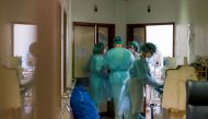 FILE PHOTO: Healthcare workers wear personal protective equipment in Santa Maria Hospital Intermediate care unit, during the coronavirus disease (COVID-19) pandemic in Lisbon, Portugal, January 18, 2021. REUTERS/Pedro Nunes