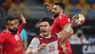 Qatar’s Allaedine Berrached in action with Bahrain’s Mahdi Saad during their match in Cairo on Saturday. 