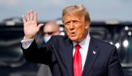 FILE PHOTO: U.S. President Donald Trump waves as he arrives at Palm Beach International Airport in West Palm Beach, Florida, U.S., January 20, 2021. REUTERS/Carlos Barria/File Photo
