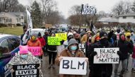 FILE PHOTO: Protesters gather outside of the home where Andre Maurice Hill, 47, was killed in Columbus, Ohio, U.S., December 24, 2020. REUTERS/Megan Jelinger
