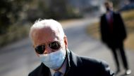 U.S. President Joe Biden talks to a reporter as he arrives on the South Lawn at the White House in Washington, U.S., February 8, 2021. REUTERS/Carlos Barria