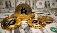 FILE PHOTO: Representations of virtual currency Bitcoin are placed on U.S. Dollar banknotes in this illustration taken May 26, 2020. REUTERS/Dado Ruvic/Illustration